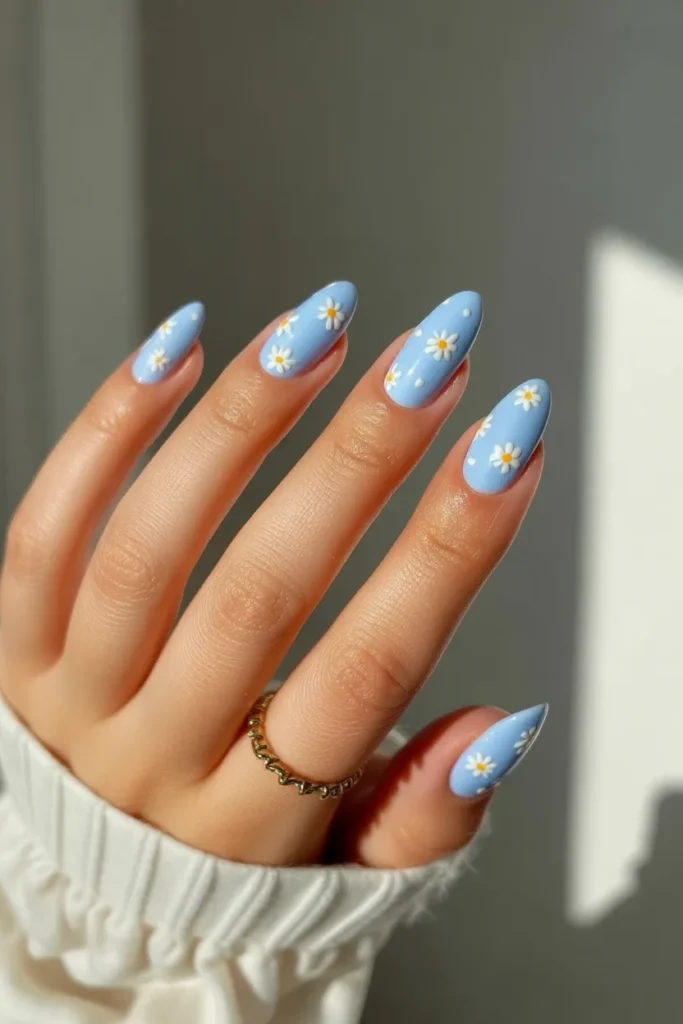 1. Baby Blue Almond Nails With Tiny White Daisies