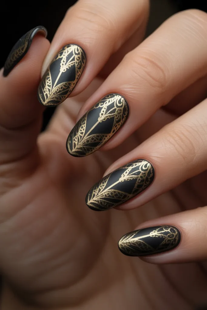 11. Black Acrylic Nails with Intricate Gold Lace Art