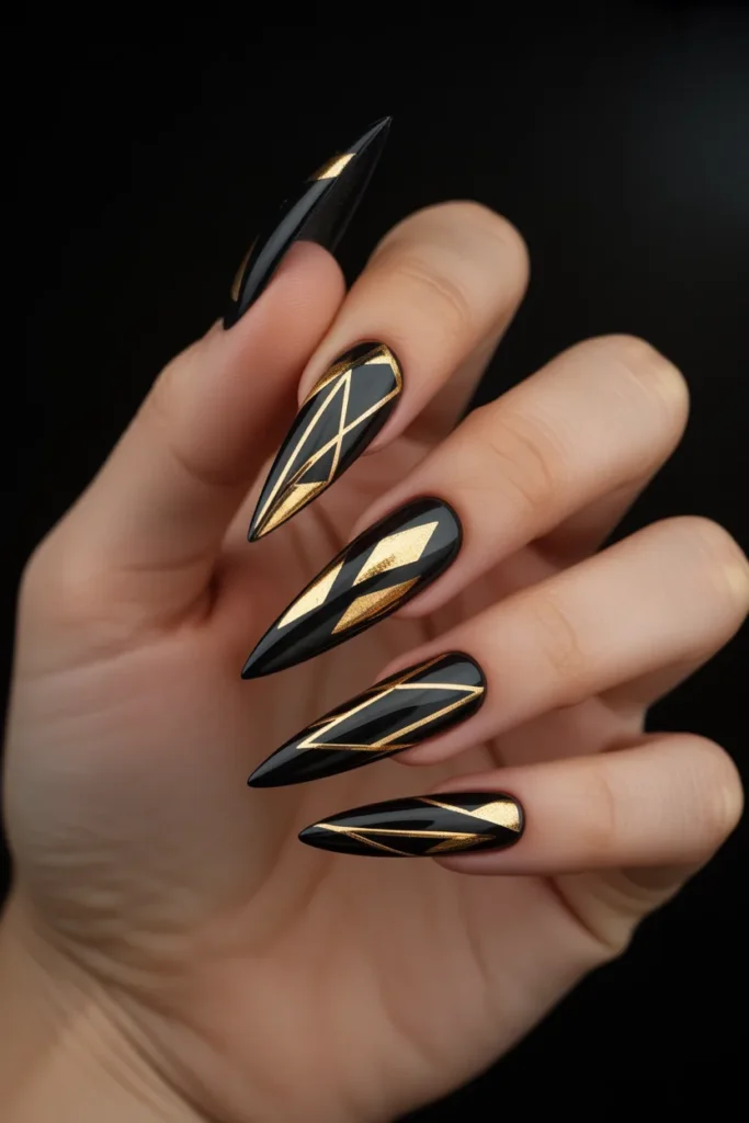 11. Black and Gold Stiletto Nails