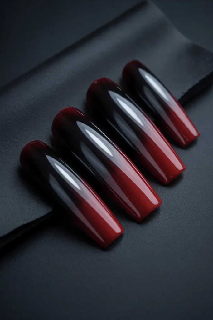 15. Extra Long Black Coffin Nails with Ombre Red Tips