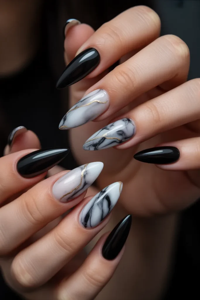 17. Black Stiletto Nails with Marble White Accent