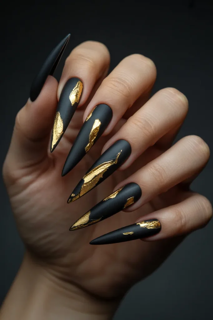 2. Matte Black Stiletto Nails with Gold Foil