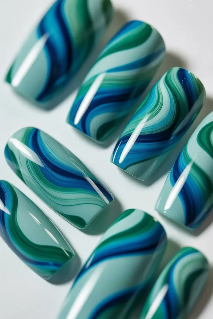 23. Aqua and Green Abstract Acrylic Nails