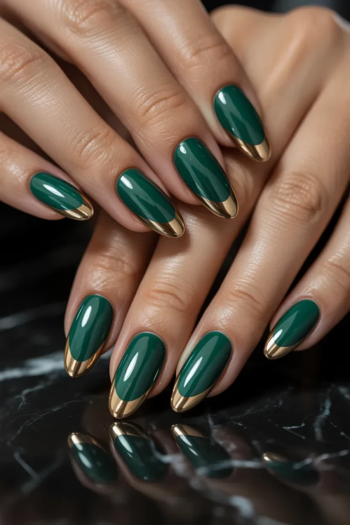 18. Deep Green Glazed Almond Nails with Gold Tips