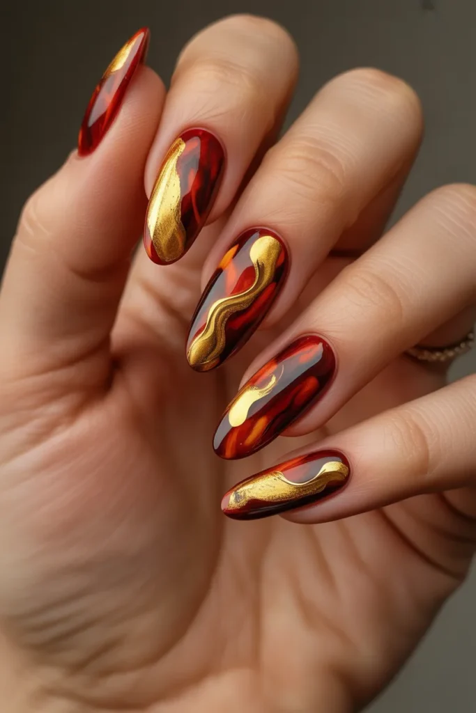 20. Aries Acrylic Nails — Abstract Red and Gold Art