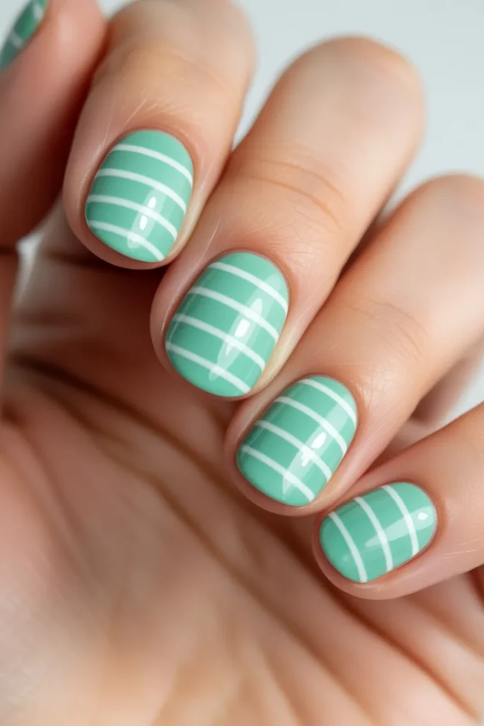 22. Mint and White Striped Nails