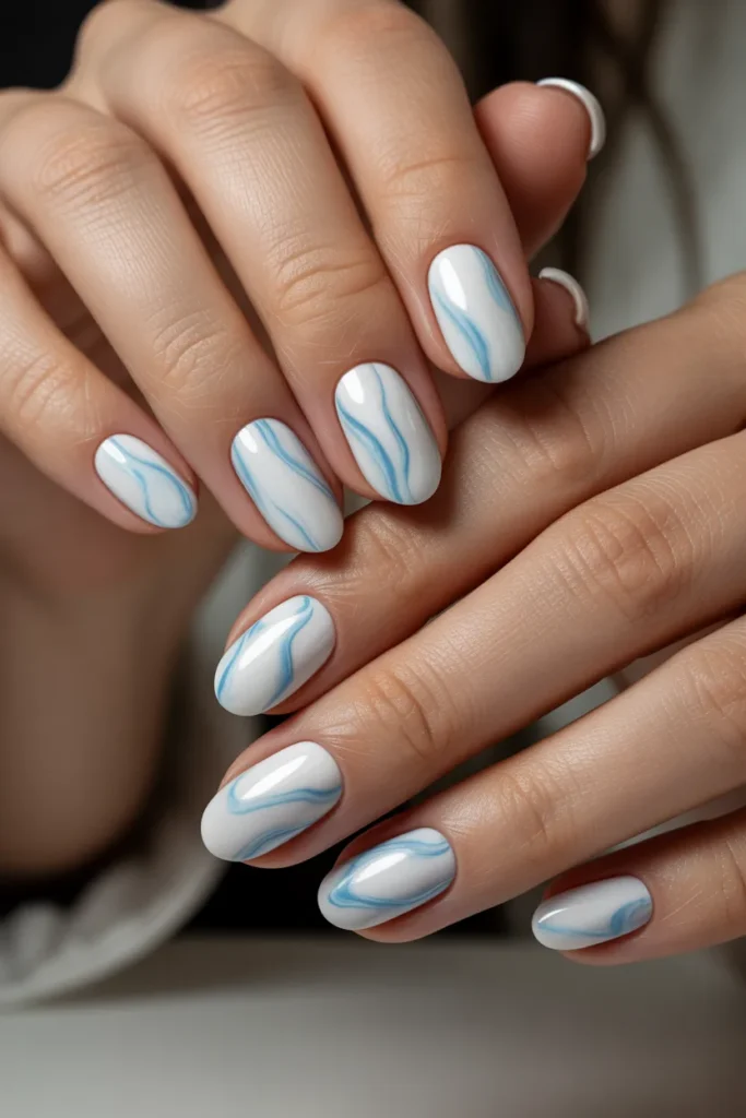 23. Light Blue Nails with Subtle Marble Effect