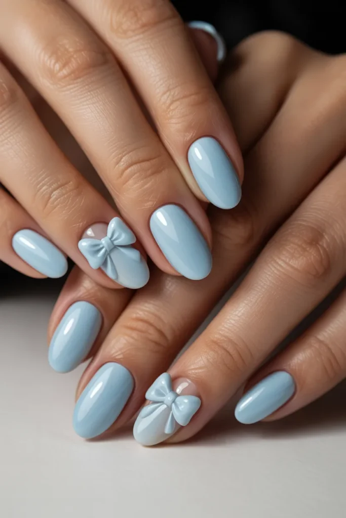24. Cute Light Blue Nails — Bow Accent Design