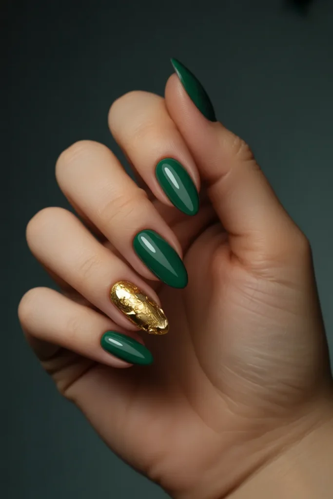 3. Gold Foil Accent Nails on Dark Green