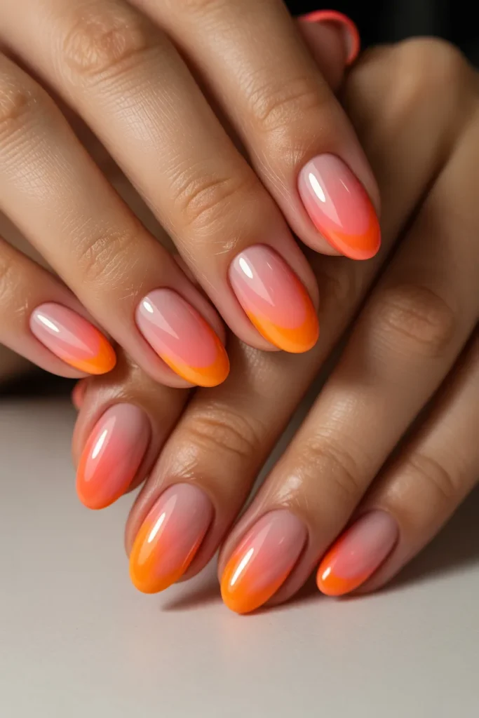 7. Ombre Sunset Nails — Pink to Orange