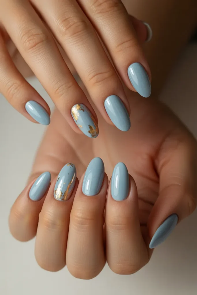 8. Light Blue Almond Nails with Gold Accents 1