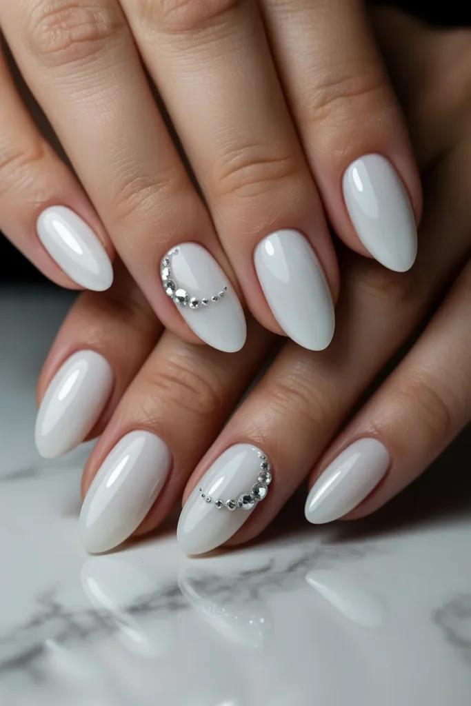 Milky White Almond Nails with Rhinestones.13