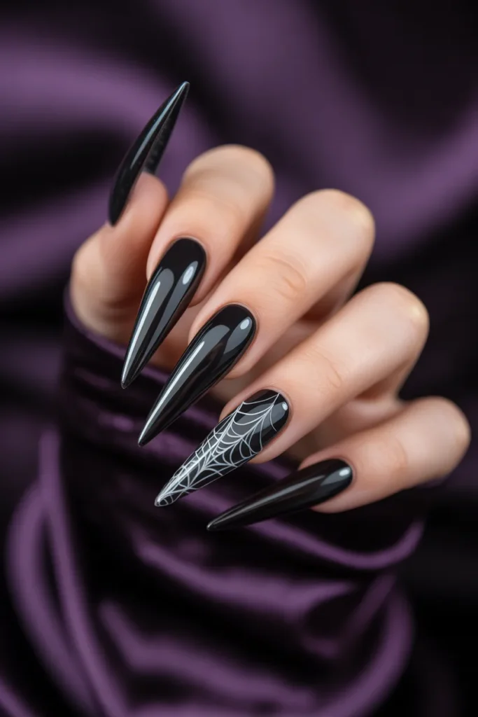 1. Classic Black Cobweb Stiletto Nails