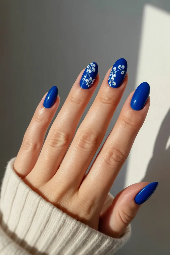 13. Royal Blue with Floral Nail Art