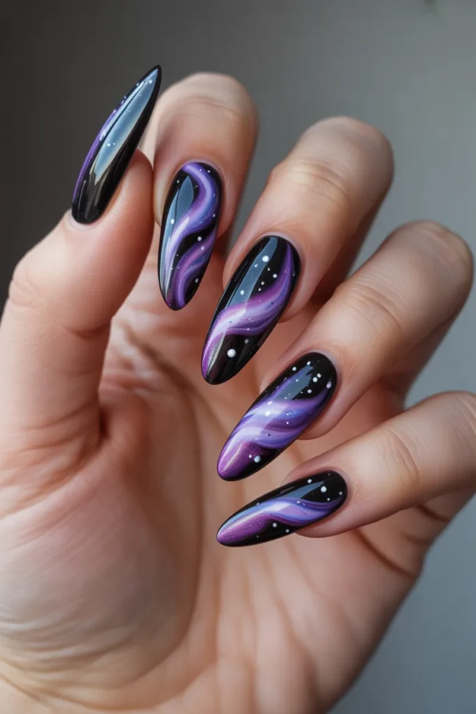 14. Galaxy and Space Inspired Black and Purple Nail Art