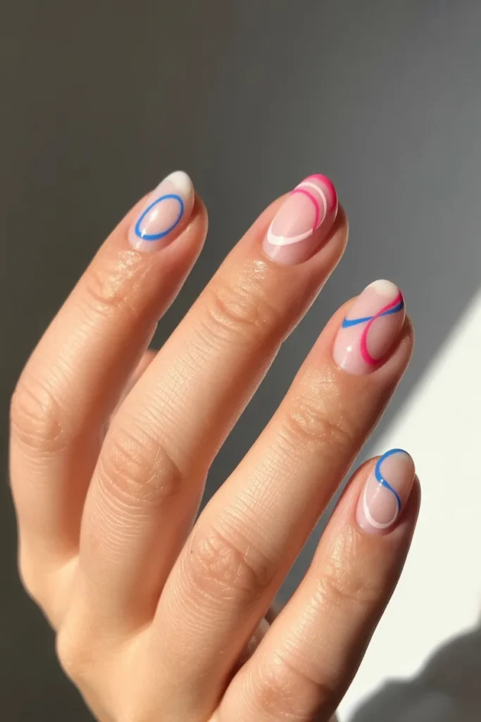 16. Simple Pink and Blue Swirl Nails — Pastel Abstract