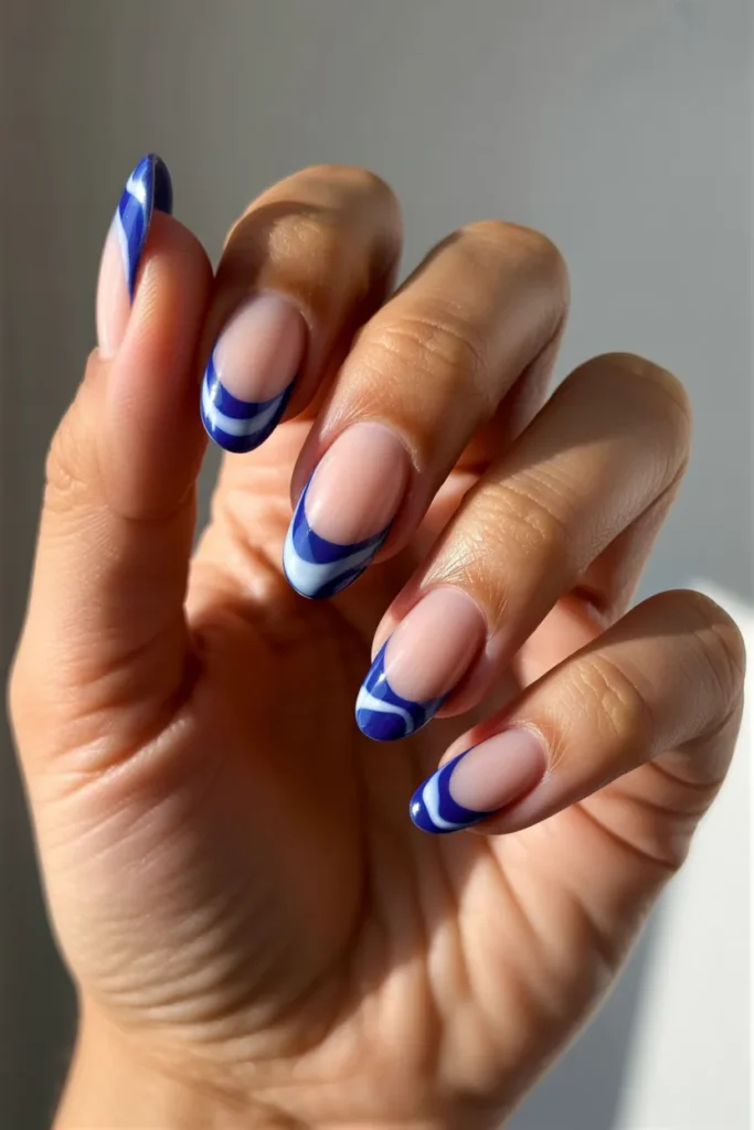 18. Blue and White Swirl French Tips — Abstract Almond