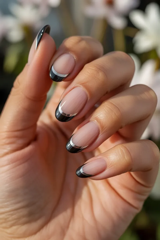 18.Black French Tip Nails with Metallic Accent
