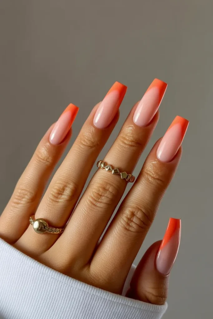 2. Coral Sunset Tips on Coffin Nails