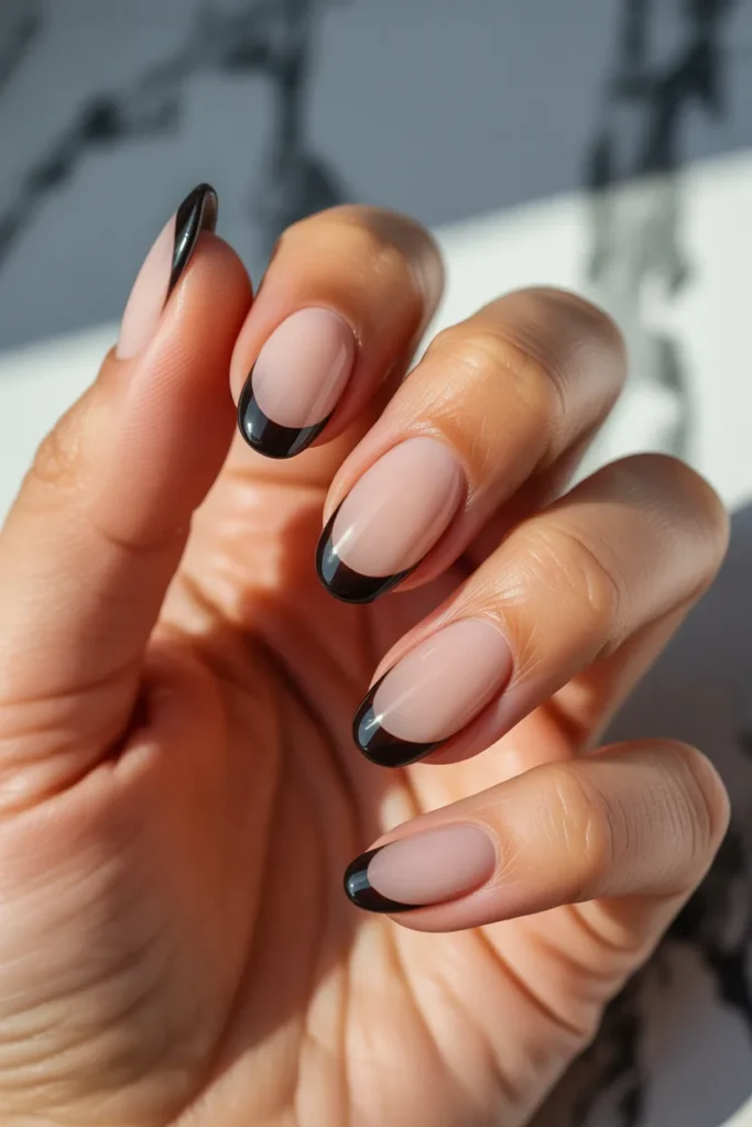 22. Black French Tip Nails with Nude Base