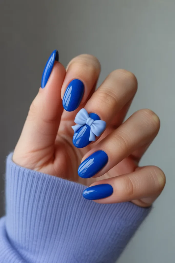 24. Royal Blue Bow Nail Art