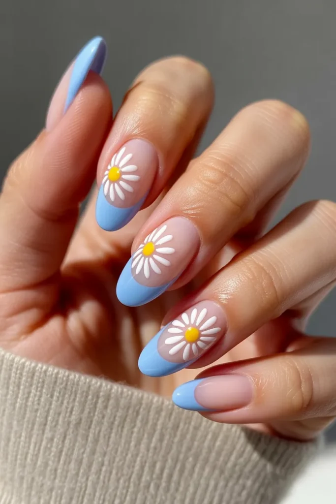 3. Blue French Tips with Tiny Daisies — Almond Shape