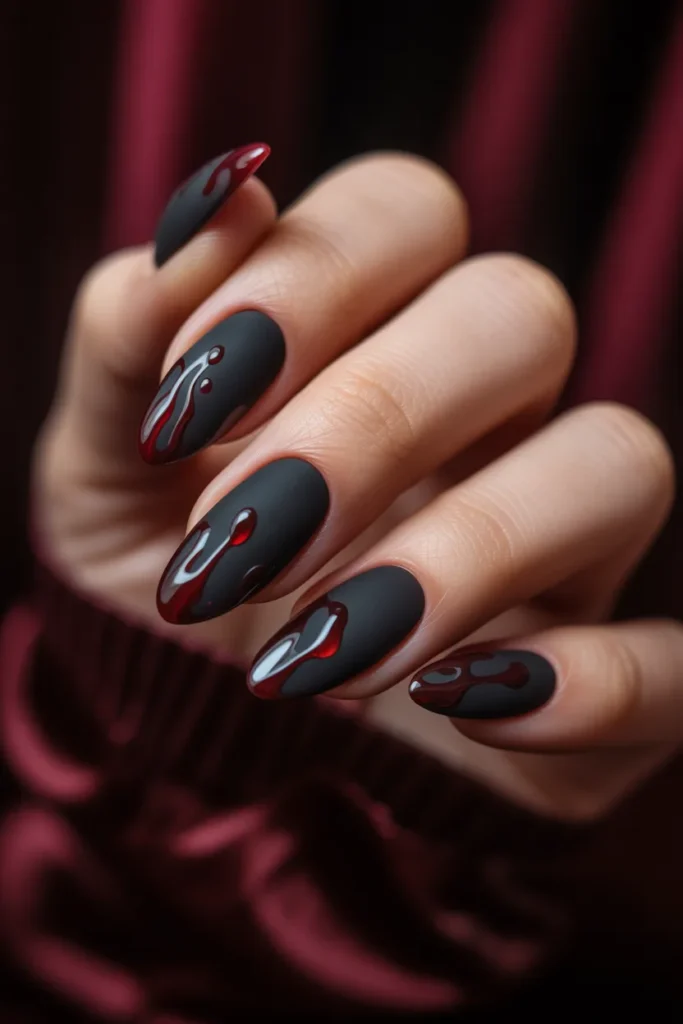 4. Edgy Black Drip Nails on Almond Shape