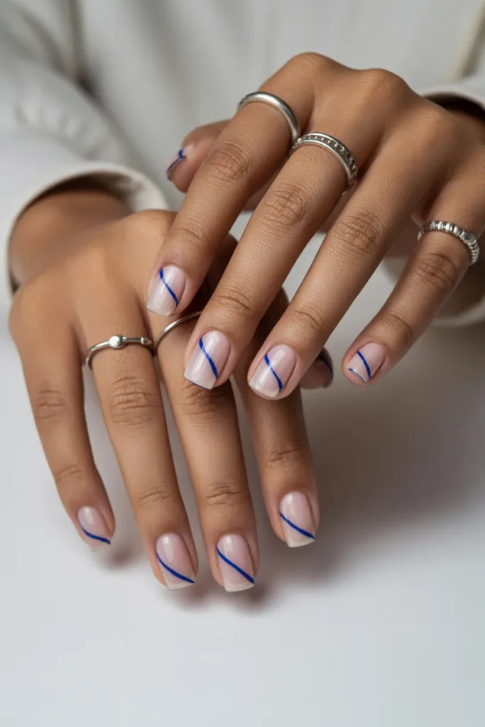 4. Minimalist Single Blue Line on Clear Nails