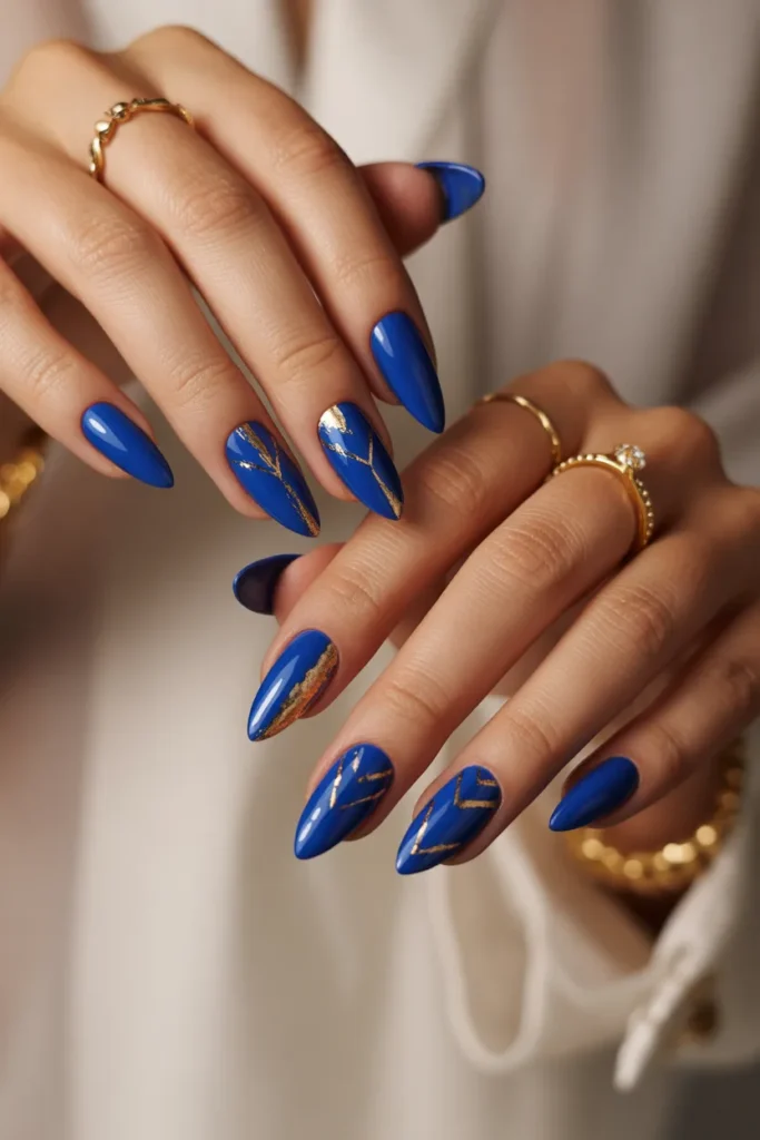 4. Royal Blue Nails with Gold — For When You Want Regal