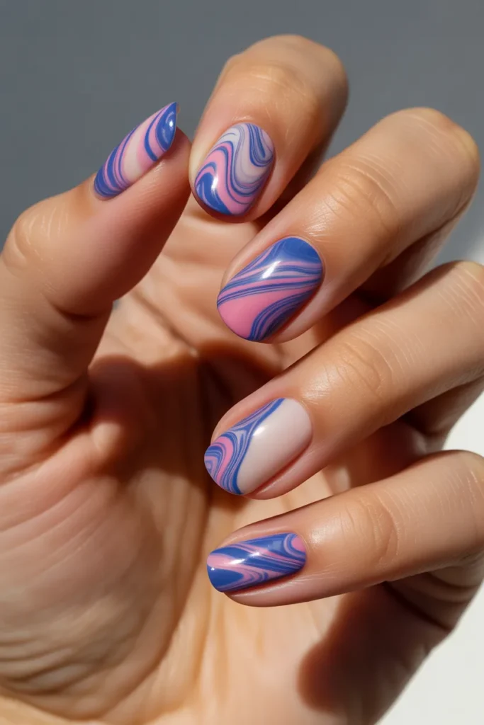 6. Blue and Pink Swirl Marble Nails