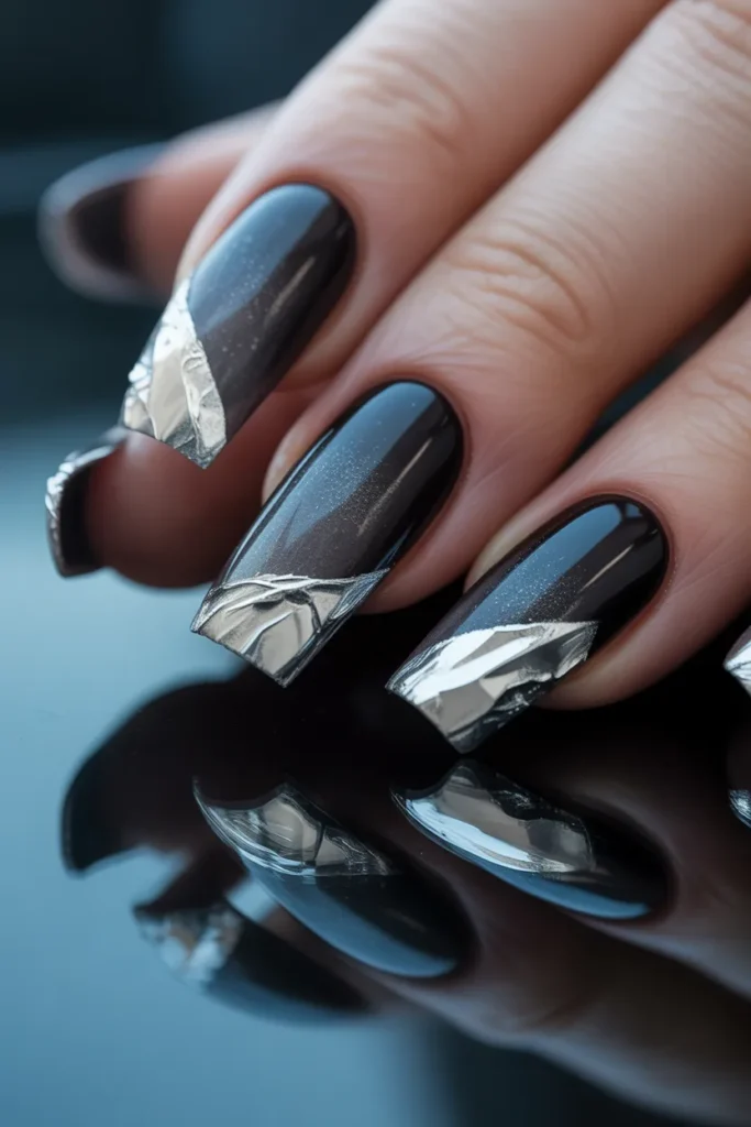 7. Black Gradient Nails with Silver Foil Accents