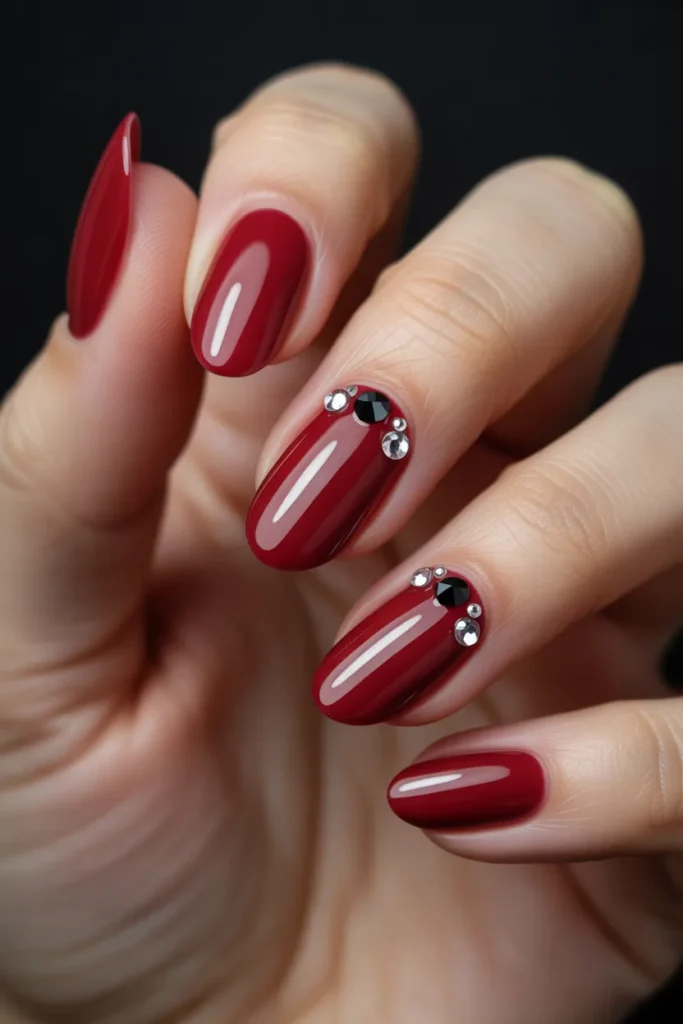 7. Red and Black Cat Eye Nails with Rhinestones