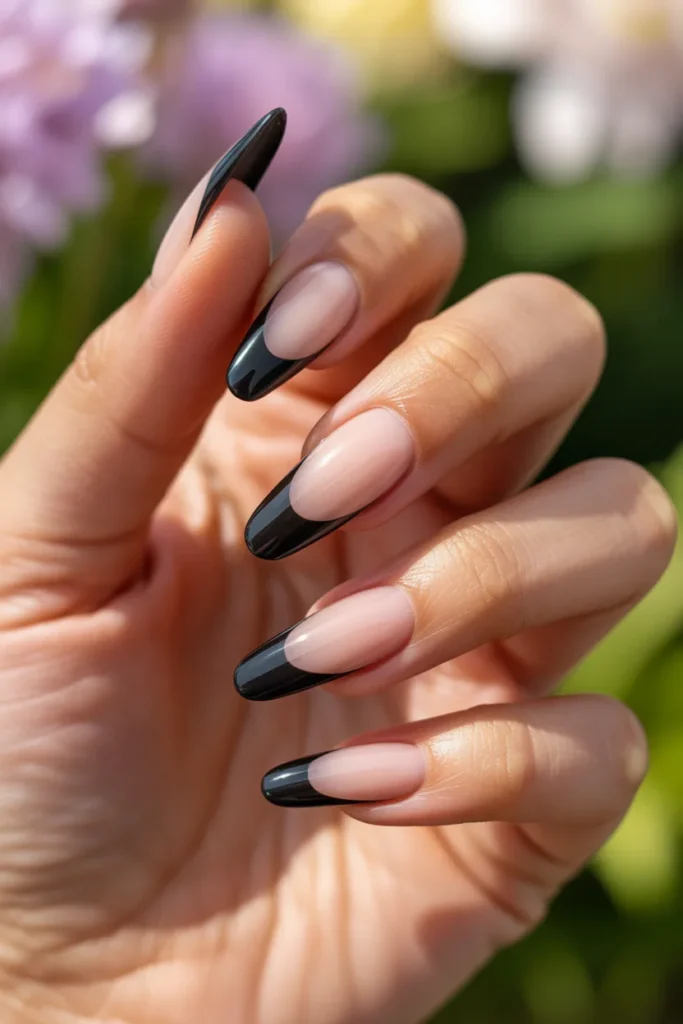 9. Black French Tip Stiletto Nails
