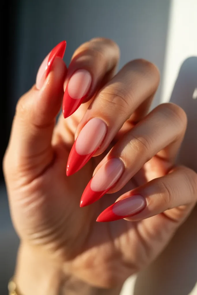 9. Red French Tips on Long Stiletto Nails