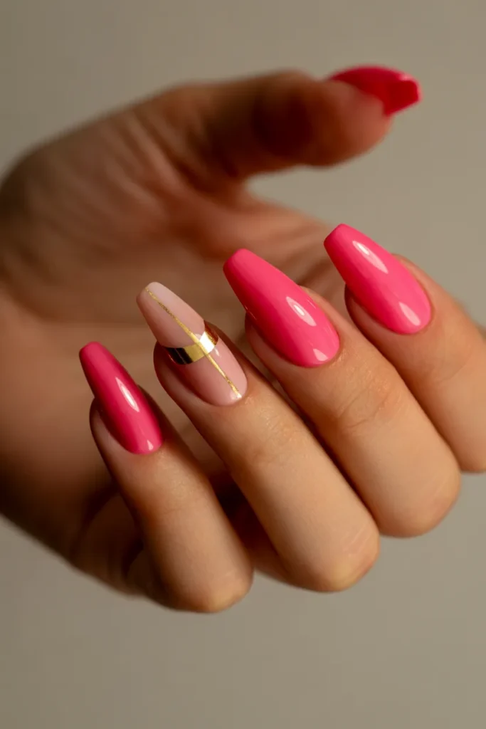 10. Hot Pink Cat Eye Nails with Gold Accent