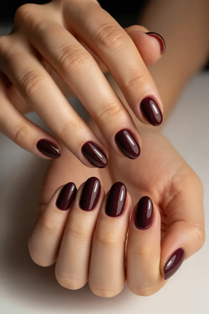 2. Oval Nails in Deep Berry — Minimizing Width with Dark Color