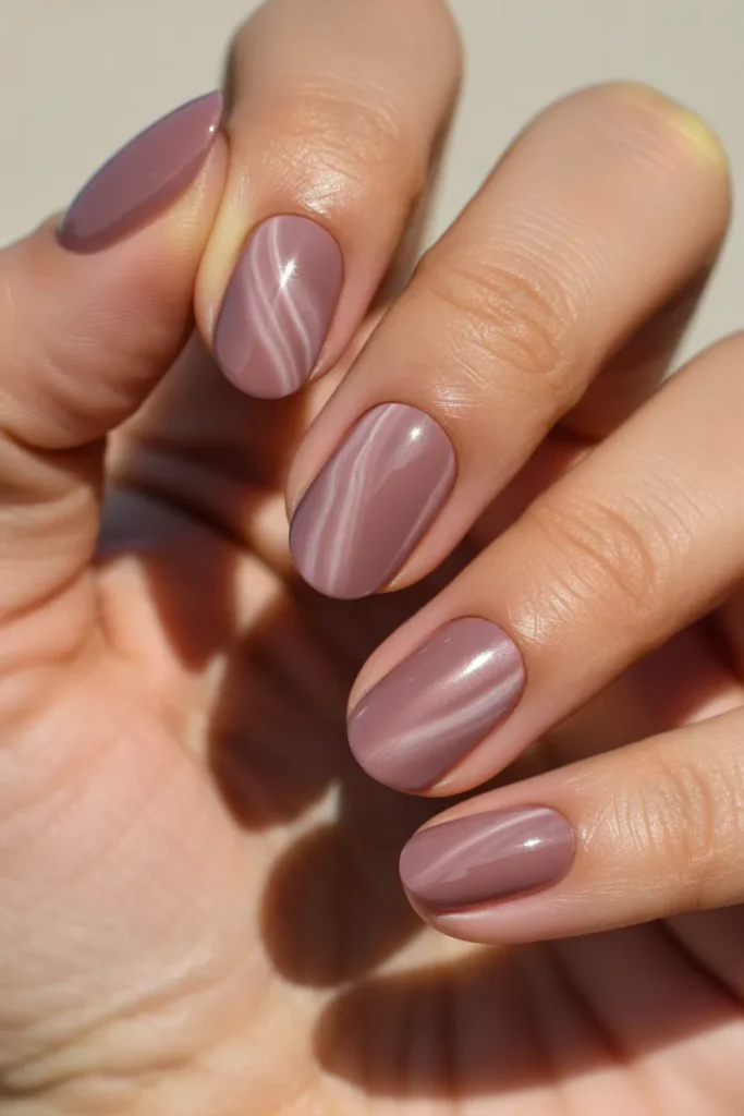 9. Dusty Rose Cat Eye Nails — Muted Sophistication
