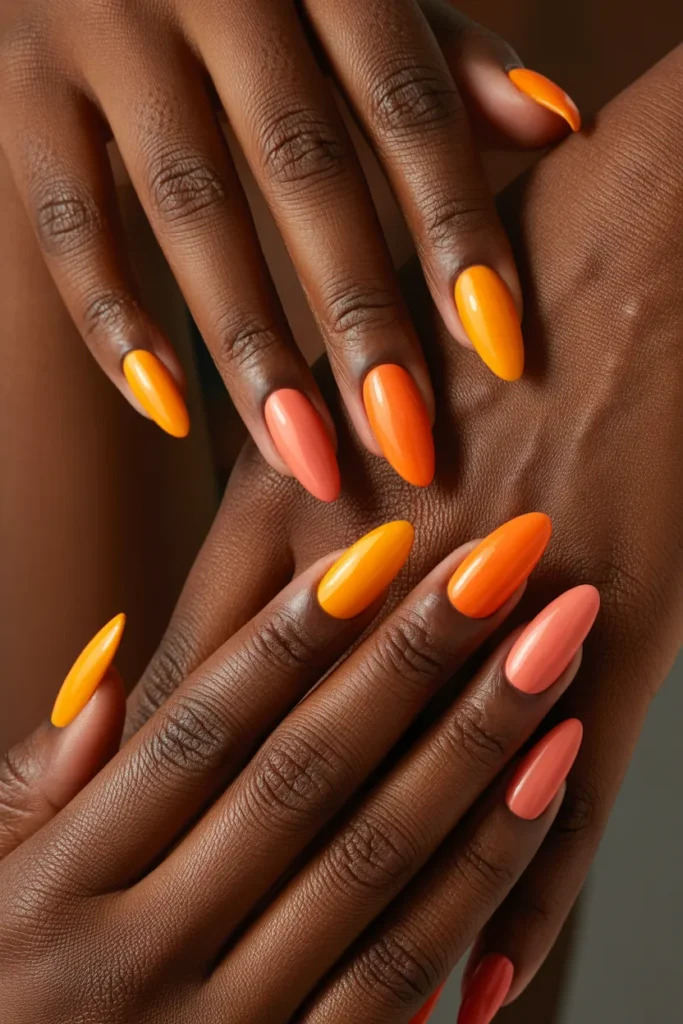 18. Aura Nails on Dark Skin — Vibrant Orange Coral